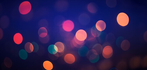 Abstract blurred bokeh lights on dark blue background with multiple colors