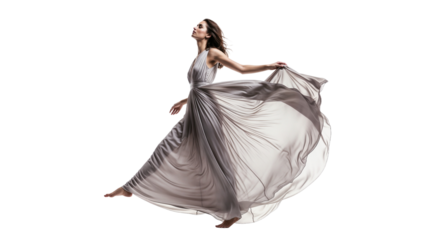 Beautiful woman in flowing dress dancing gracefully in a studio with white background