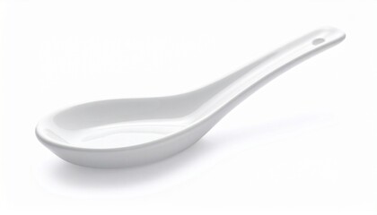 White ceramic soup spoon with broad bowl and short handle on neutral background for editorial culinary photography traditional utensil decor and poetic nourishment-themed visuals