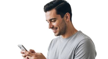 Young man smiling while using smartphone in indoor setting during daytime