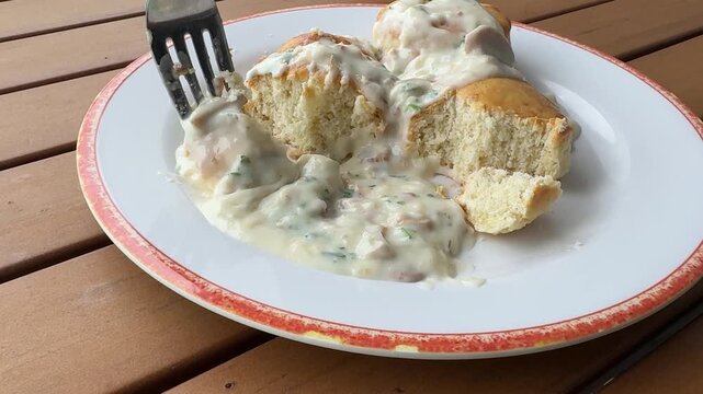 Eating Southern Sausage Gravy on Biscuits 