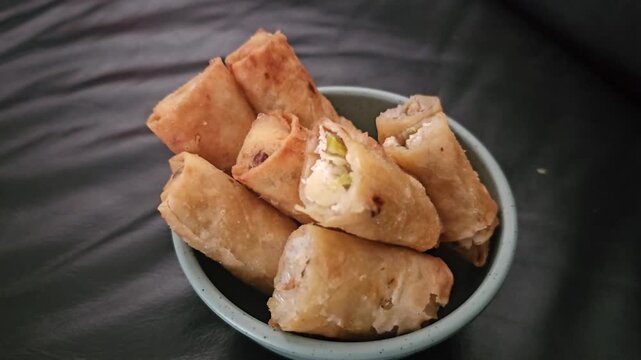 mushrooms on a plate Lumpia bihun,Risol bihun,Fried spring roll with filled vermicelli and vegetables.Indonesian fried snack,Gorengan,Various Indonesian fritter,usually eat for snack,breakfast 