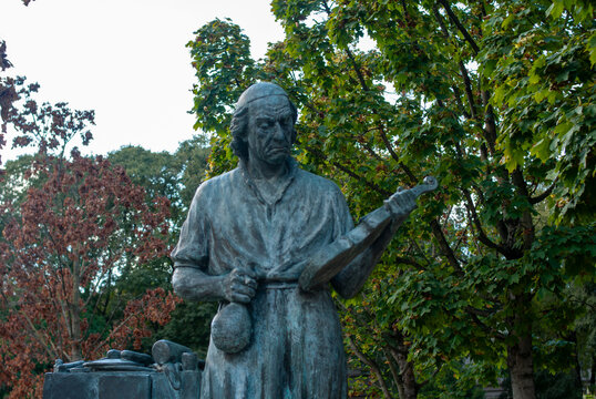Statue of renowned violin maker Antonio Stradivari holding a violin in Piazza Marconi Cremona Italy historical craftsmanship honored