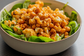 healthy fall salad with roasted cauliflower and chickpeas close up