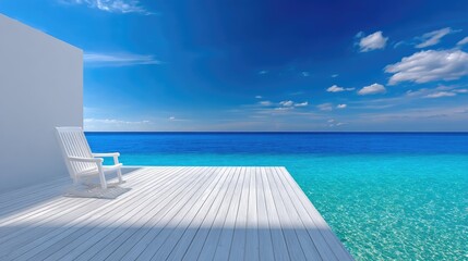 White Lounge Chair on White Wooden Deck Overlooking Turquoise Ocean Under Bright Blue Sky with Clouds