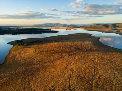 A large paddock stretching into Lake Wivenhoe