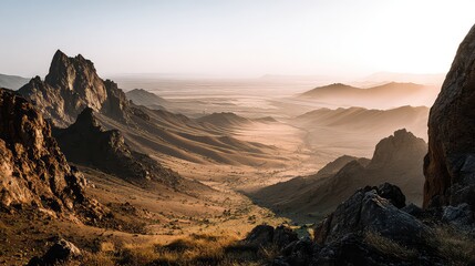 Fototapeta premium Majestic Mountain Landscape at Sunrise with Golden Light and Vast Valleys in Background
