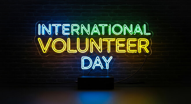 Neon Sign Celebrating International Volunteer Day with Reflections on Pavement