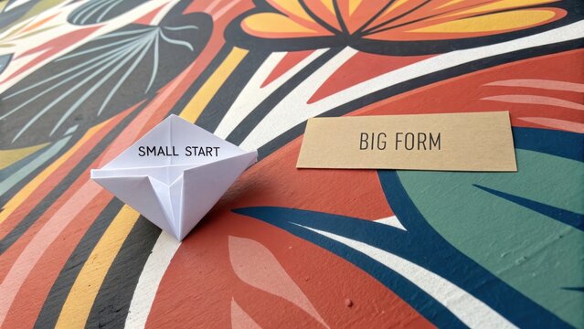 White origami paper form on a textured colorful background