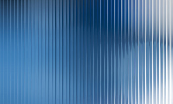 An abstract background featuring a uniform pattern of vertical, illuminated stripes reminiscent of fluted or reeded glass. The texture subtly blurs a vibrant blue and white gradient behind it.