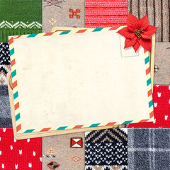 Fototapeta premium Letter to Santa Claus. Christmas background with retro postcard and poinsettia on wool sweater texture. Nostalgic holiday backdrop with cozy knitted wool material and vintage card. Copy space for text