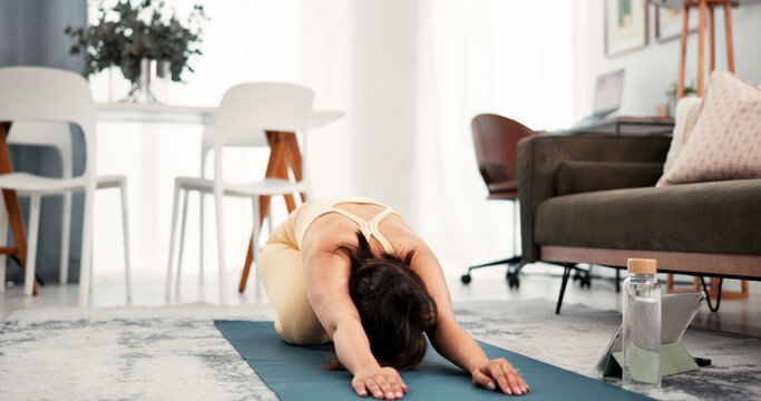 Yoga, home workout and woman stretching with tablet, warm up routine and online tutorial. Digital class, live session or person streaming fitness video in lounge, exercise mat or follow steps - Powered by Adobe
