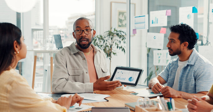 Tablet, meeting and business people with statistics, kpi research and data analysis in office. Teamwork, startup agency and workers on digital tech with graph, chart and seo report for website growth - Powered by Adobe