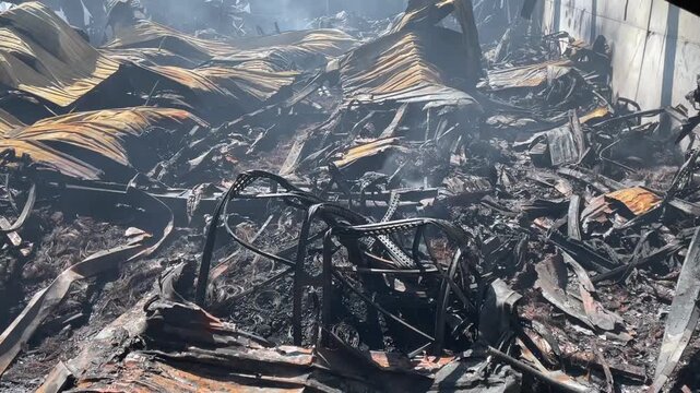 Devastating aftermath of a building fire with smoldering ruins