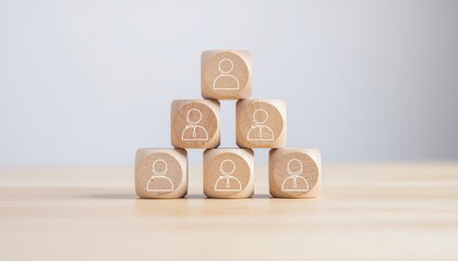 Build a strong team with wooden blocks symbolizing employees and leadership, perfect for training materials or recruitment campaigns, showing team structure