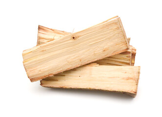 A stack of split firewood on a white background 
