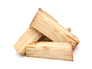 A stack of split firewood on a white background 