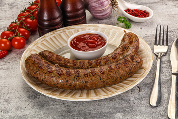 Grilled beef sausages with sauce
