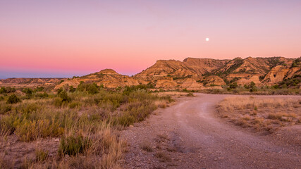 Lunar landscapes of the Monegros desert at sunrise and sunset, Spain