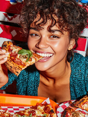 Smiling woman eating pizza in a colorful restaurant