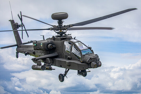 Military Apache Helicopter Flying at Low Altitude