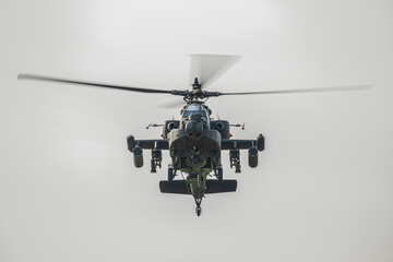 Military Apache Helicopter Flying at Low Altitude