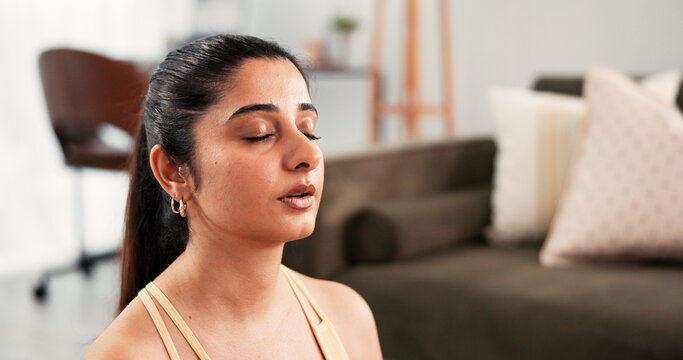 Woman, breath and yoga with meditation at house for fitness, spiritual awareness and zen. Person, eyes closed and mindfulness practice for inner peace, holistic healing and balance for mental health