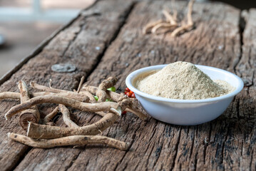 Withania Somnifera, Ashwagandha, Indian Ginseng, Poison Gooseberry or Winter Cherry on the wooden Background. Medicinal Herb