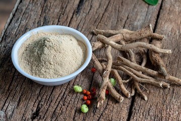 Withania Somnifera, Ashwagandha, Indian Ginseng, Poison Gooseberry or Winter Cherry on the wooden Background. Medicinal Herb