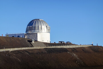Fototapeta premium Massive silver observatory dome standing on volcanic summit plateau