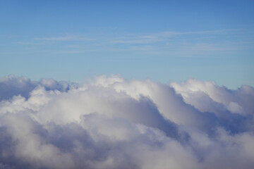 Soft pastel cloudscape viewed from high mountain vantage point