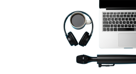 Silver laptop, white coffee mug, over-ear headphones, black shotgun microphone flat lay on light blue background, soft light, productivity concept