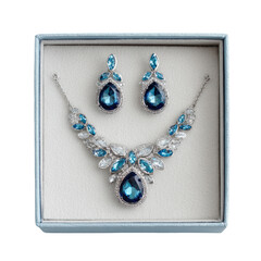 Necklace and earrings set with blue gems in light blue box