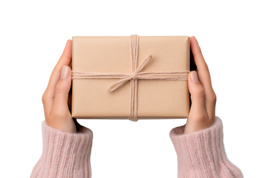 Hands holding a beautifully wrapped gift box with a natural twine bow on a white background.