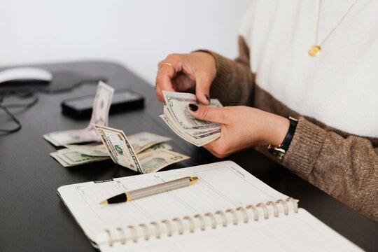 close up of a man counting money