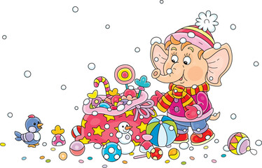 Cute little elephant in winter clothes with a holiday gift bag full of funny colorful toys and sweets, vector cartoon illustration on a white background