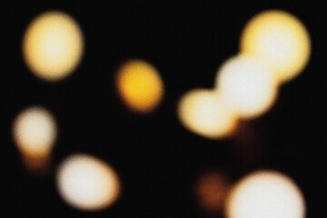 Soft yellow illumination with cinematic blur and grainy dust overlay, creating an elegant modern background texture for design, film, and digital art projects