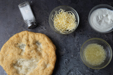 Hungarian traditional fast food - deep fried flatbread, Lángos