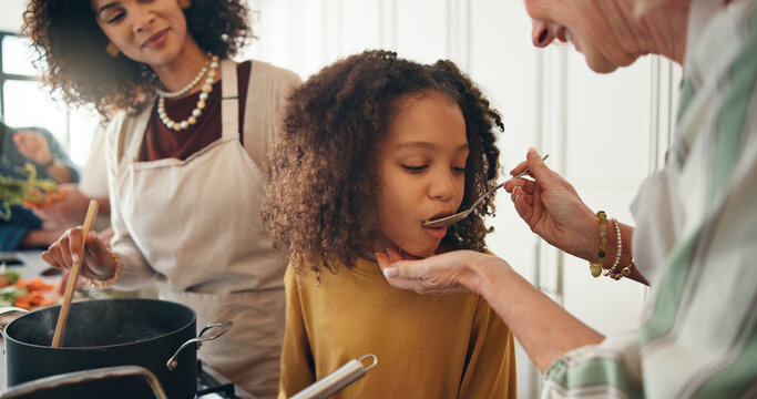 Family, cooking or child in kitchen with taste, bonding together or meal prep for Christmas buffet. Culinary, grandparent or kid in house with feeding, connection or ingredient try for holiday food. - Powered by Adobe