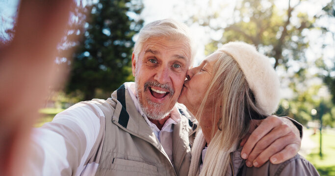Portrait, selfie or old couple in park with kiss for connection, commitment or healthy relationship. Happy people, elderly man and senior woman outdoor for hug, love photography and bonding together. - Powered by Adobe