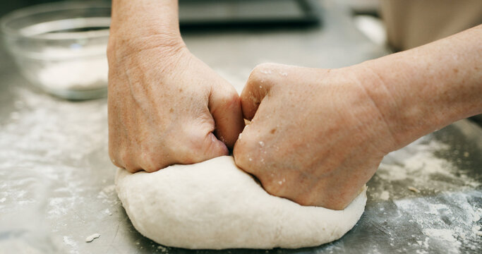 Bread, dough and hands of baker in kitchen for restaurant, cooking and mixing flour. Bakery, ingredient and kneading with person baking in cafe for wheat pizza base, coffee shop and culinary process - Powered by Adobe