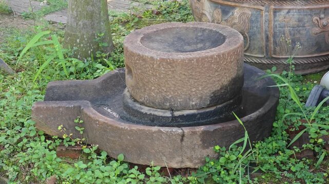 Old millstone or grindstone. Vintage.