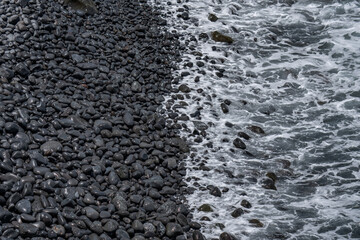 cobble on the beach. Scenic Point near Huialoha Church (1859).  Hawaii Route 31 ( Pi'ilani Highway ), Papaloa, Maui, Hawaii. Kula Volcanics, Lava flows.  Haleakalā, or the East Maui Volcano
