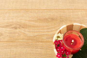 Candle in the wooden basket.