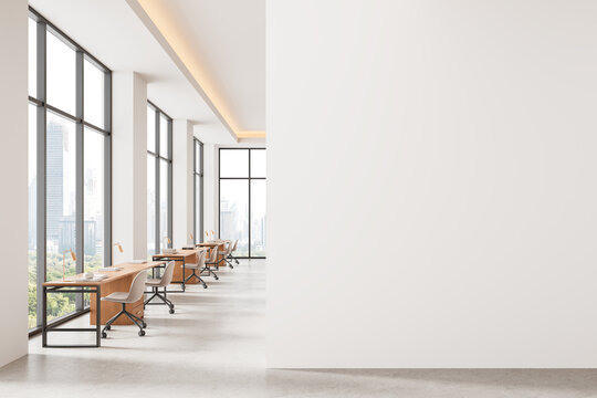 Modern office interior with large windows and empty white wall for poster or canvas mockup presentation in bright minimalist design concept layout. 3D Rendering