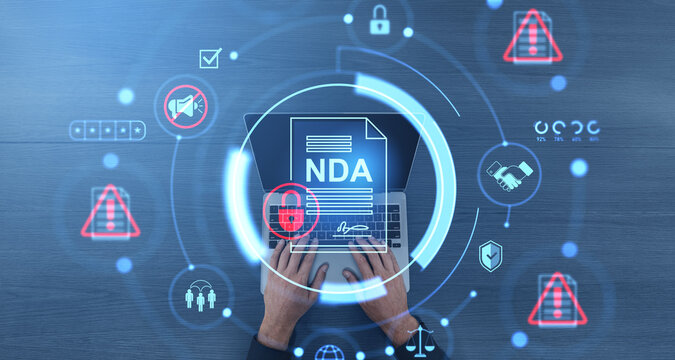 Non-disclosure agreement NDA concept with digital security icons and hands typing on laptop, top view on wooden background with futuristic interface.