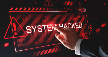 Cybersecurity breach alert with "SYSTEM HACKED" warning sign and hand touching digital interface in red futuristic style on dark background concept.