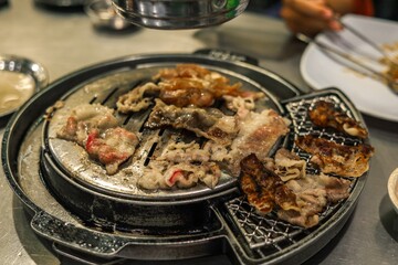Close up Delicious Korean Barbecue Grill with Thin Slices of Beef