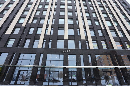 AKADEMGORODOK, NOVOSIBIRSK - 08 NOVEMBER 2025: The facade of the Port i7 Business Center in Novosibirsk's Akademgorodok on winter background.
