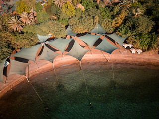 
Aerial View of the Shaded Beach Area at Dolphin Reef, Eilat, Israel &ndash; Red Sea Coastline

